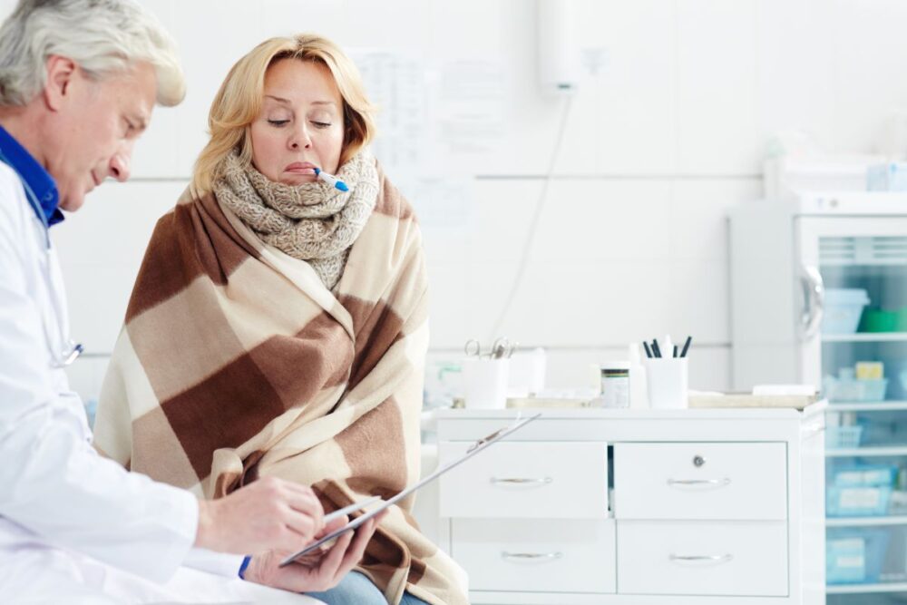 Doctor examining a patient with GI infection symptoms