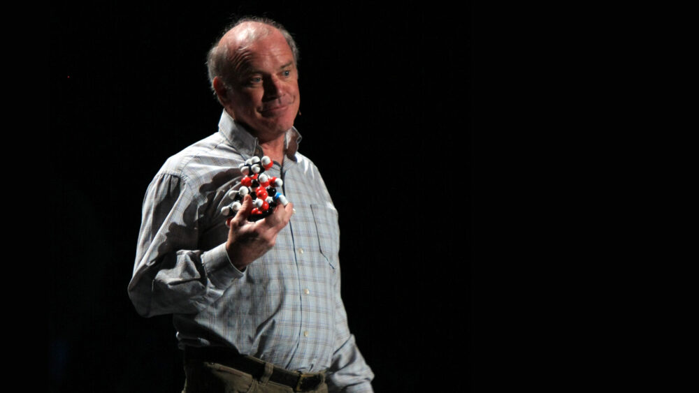Kary Mullis holding a molecular model