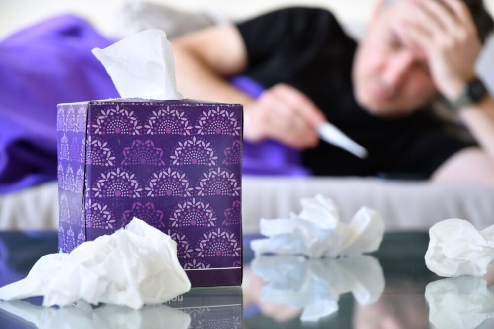 Man experiencing symptoms of seasonal influenza A infection