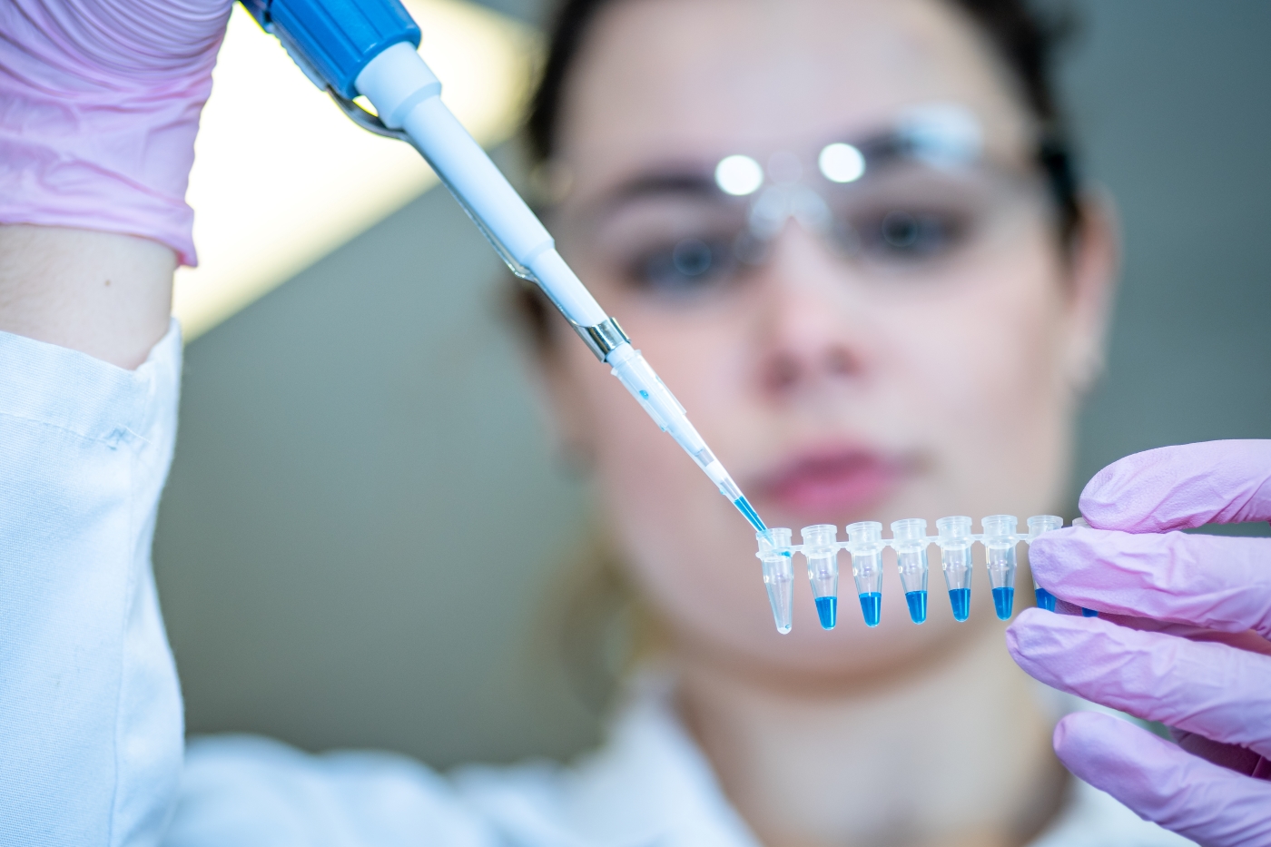 Woman researcher performing PCR test